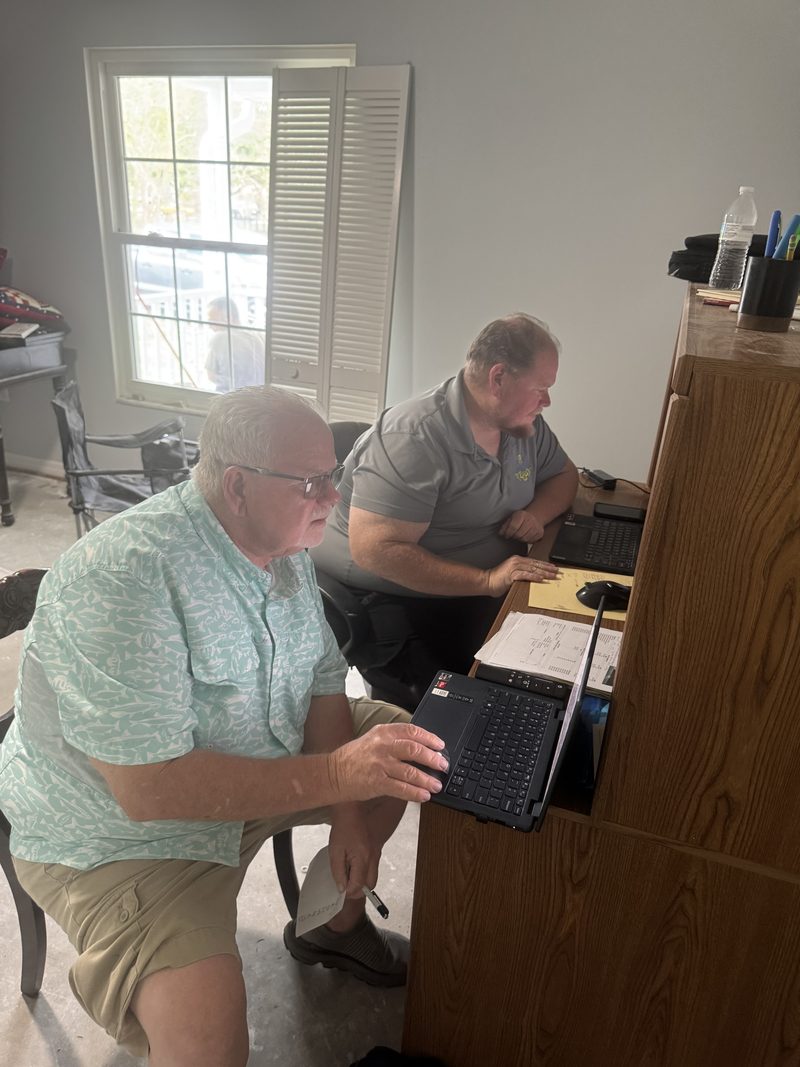 Mike going through the numbers with a homeowner