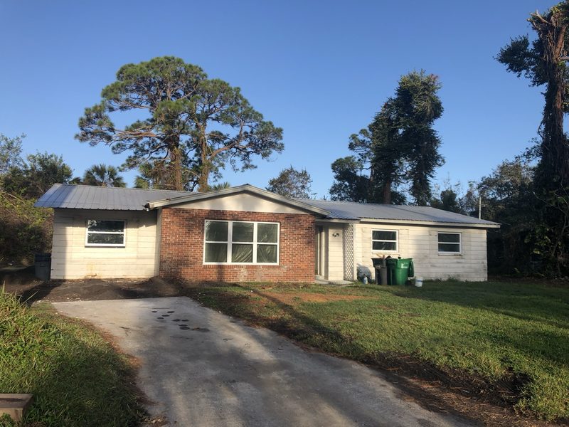 Melbourne home exterior before: overgrown landscaping and tired paint